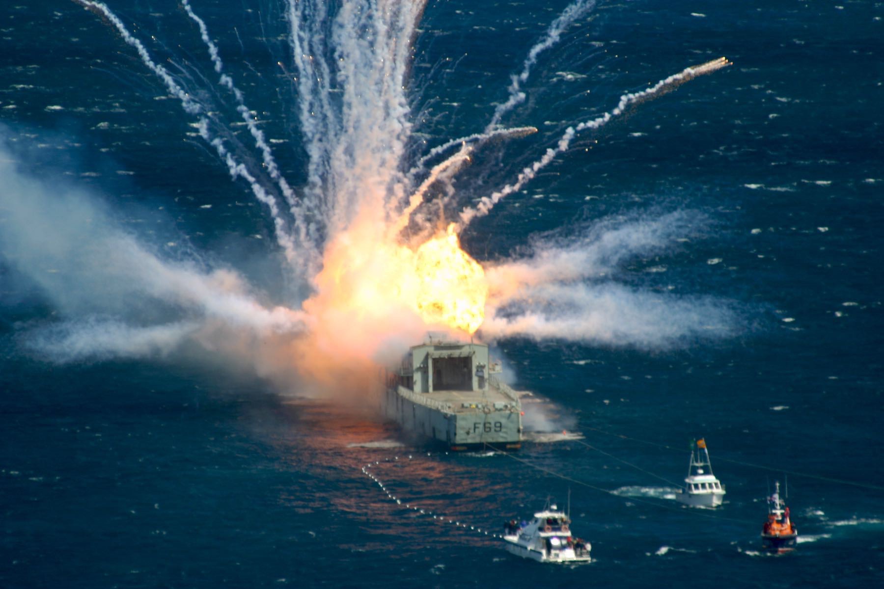 Flames engulf the rear of Navy frigate Wellington.
