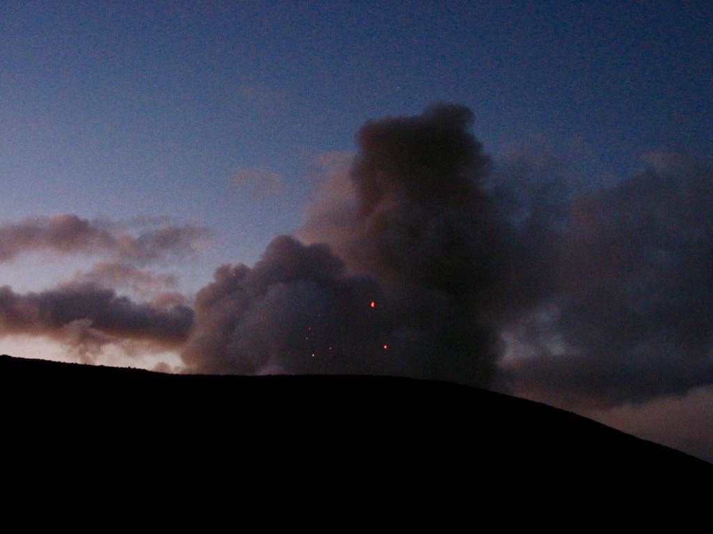 ALmost dark skies, dark smoke and red hot rocks. 