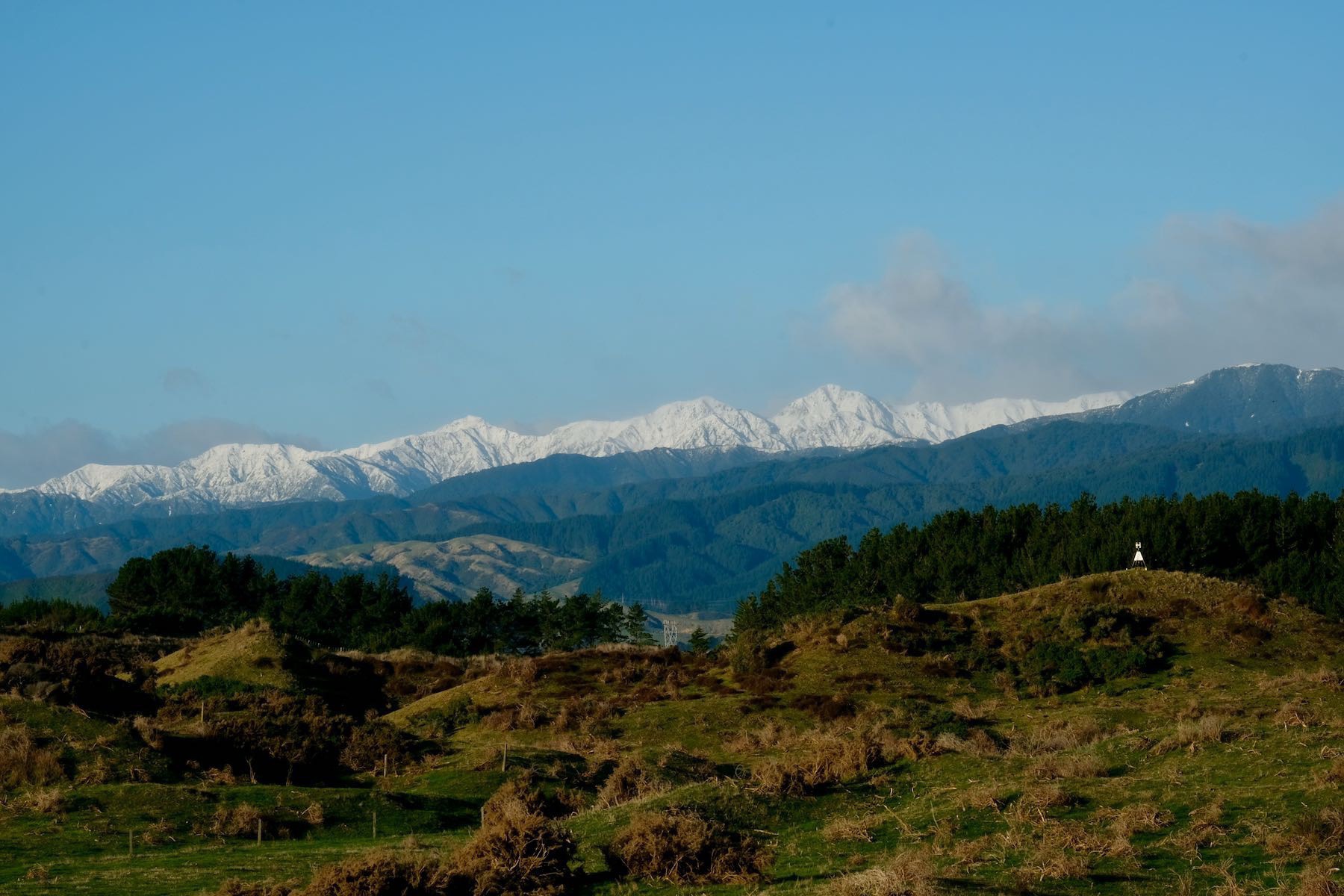 Snow-clad hill peaks. 