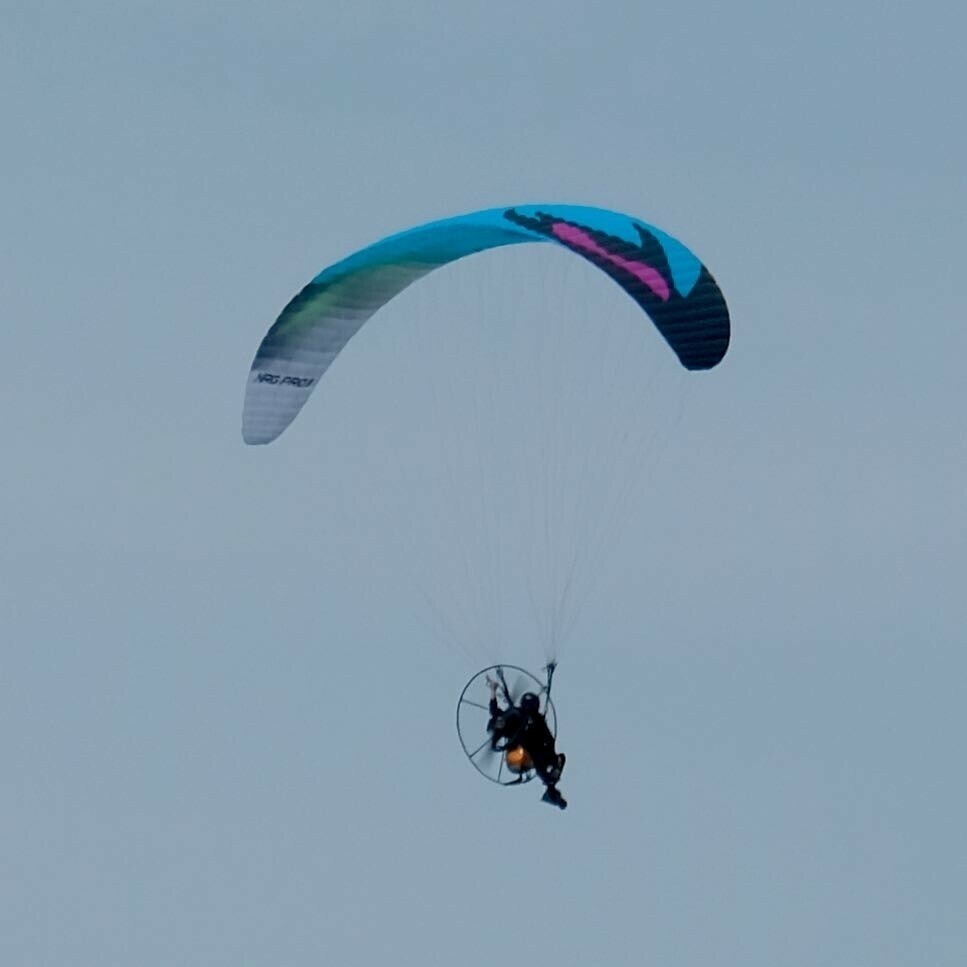 Close up on the microlight and pilot. 