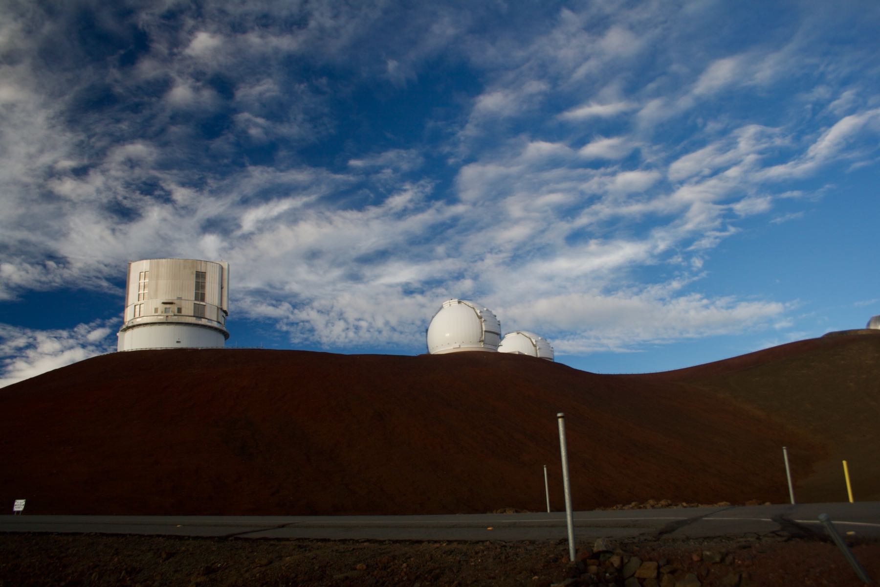 Three observatories on a Mauna Kea ridge.