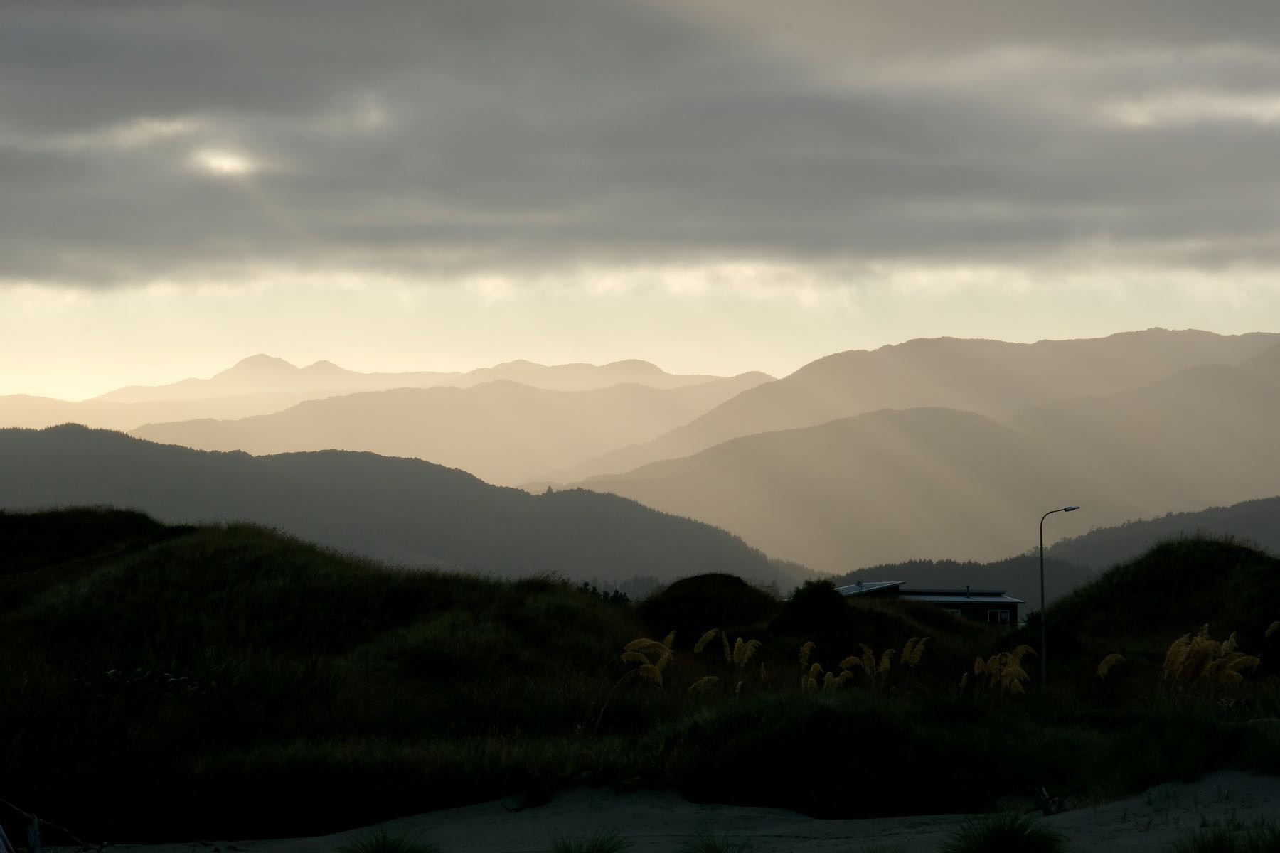 Layers of mountain ridges in a hazy morning light. 