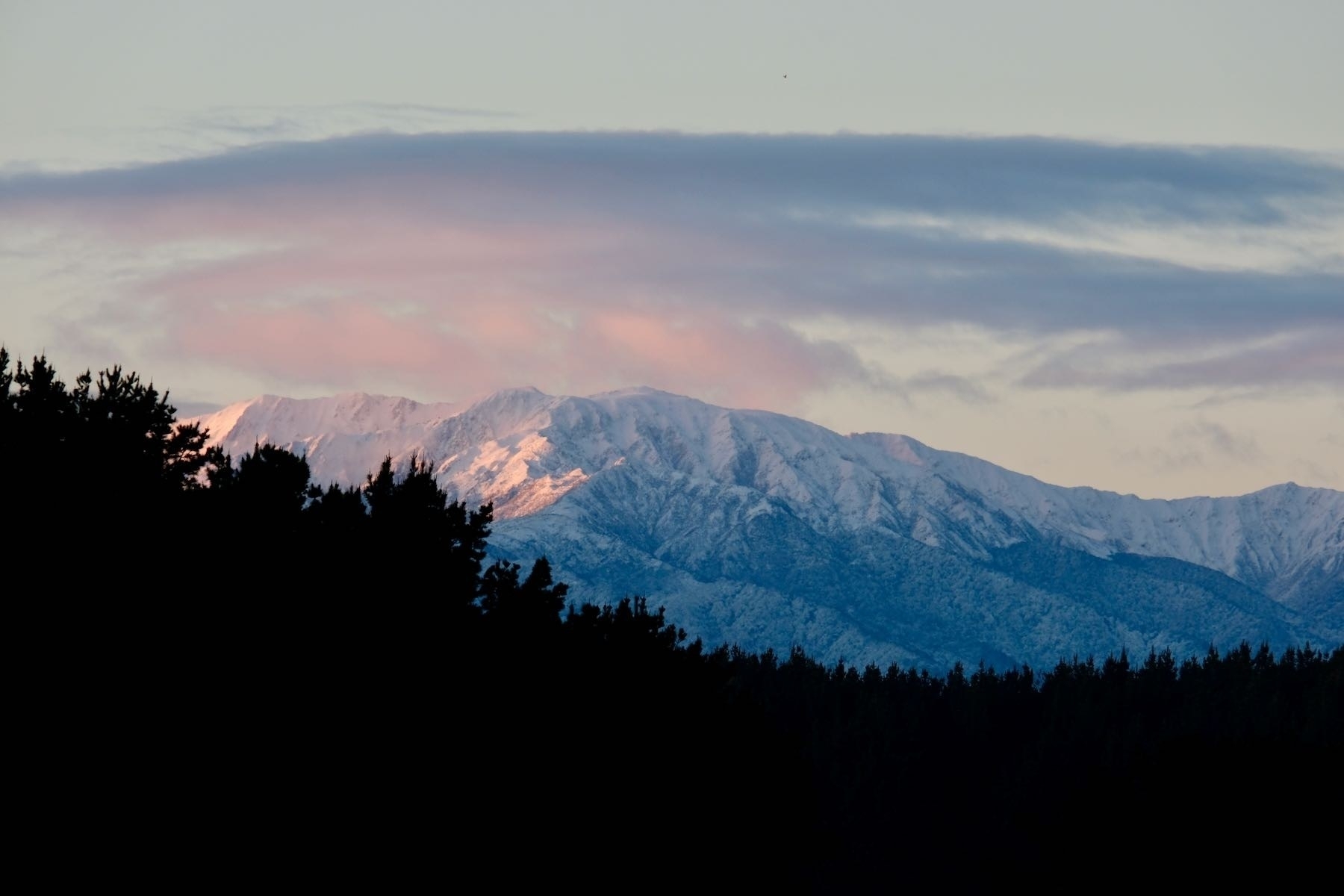 Snow clad mountain at sunrise. 