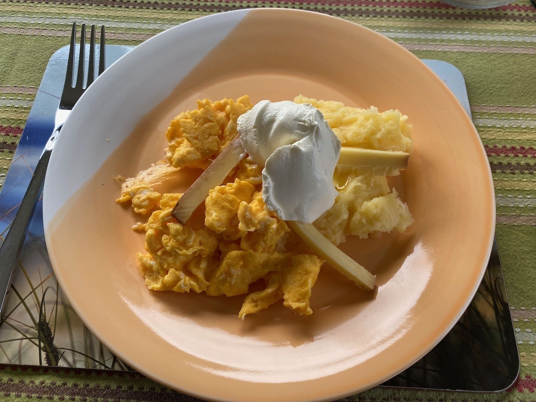 The breakfast on a plate ready to eat. 