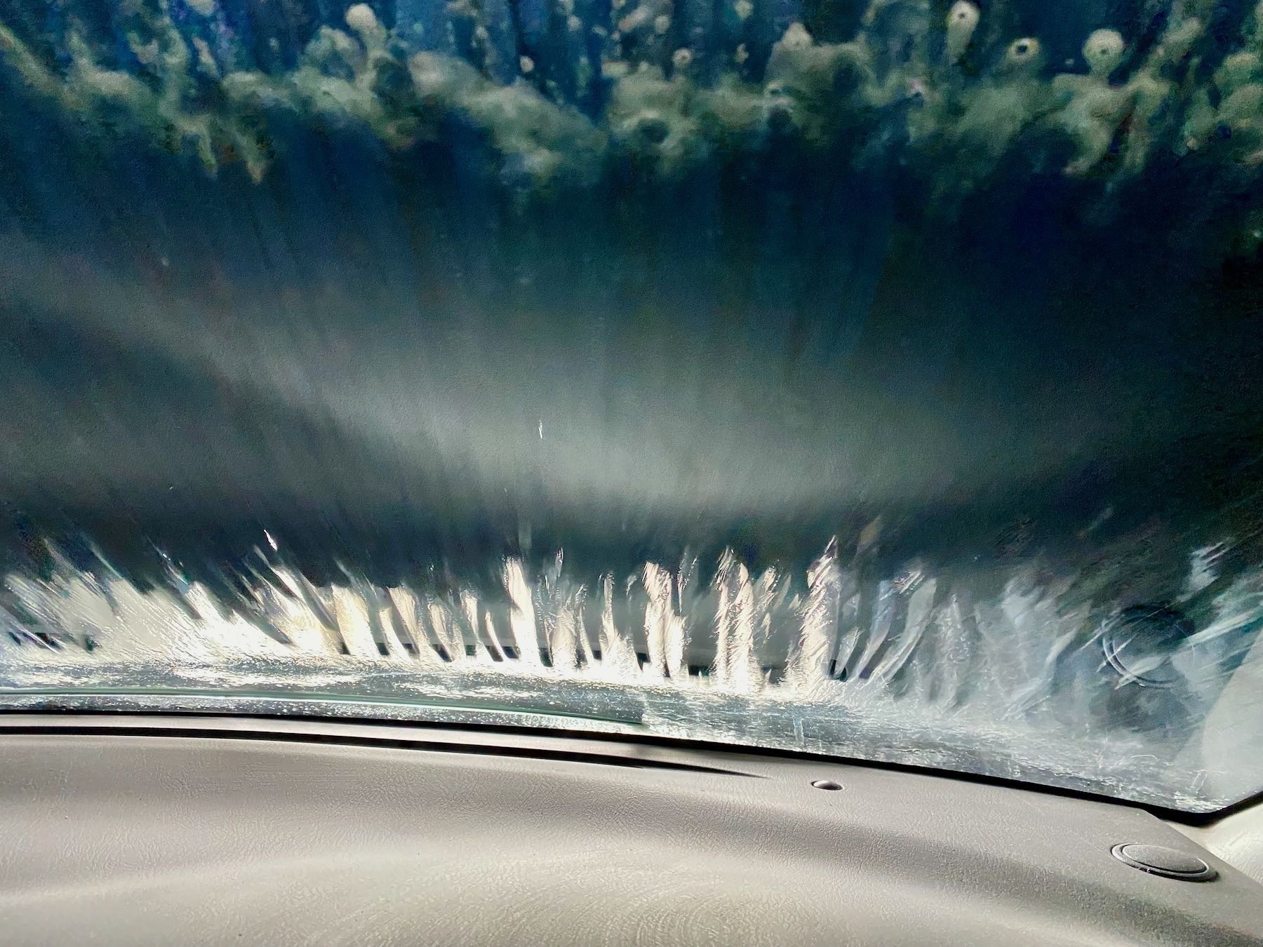 Carwash brush on the windscreen. 