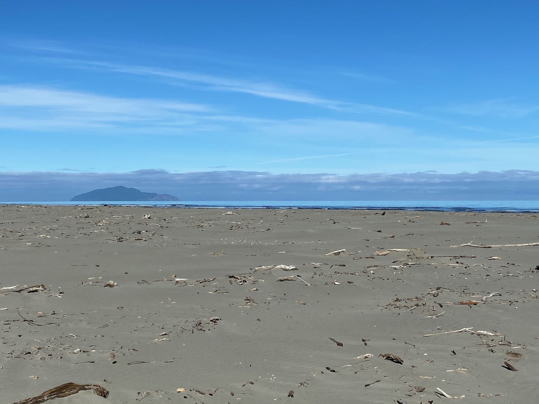 Sand, sea sky and Kāpiti Island.