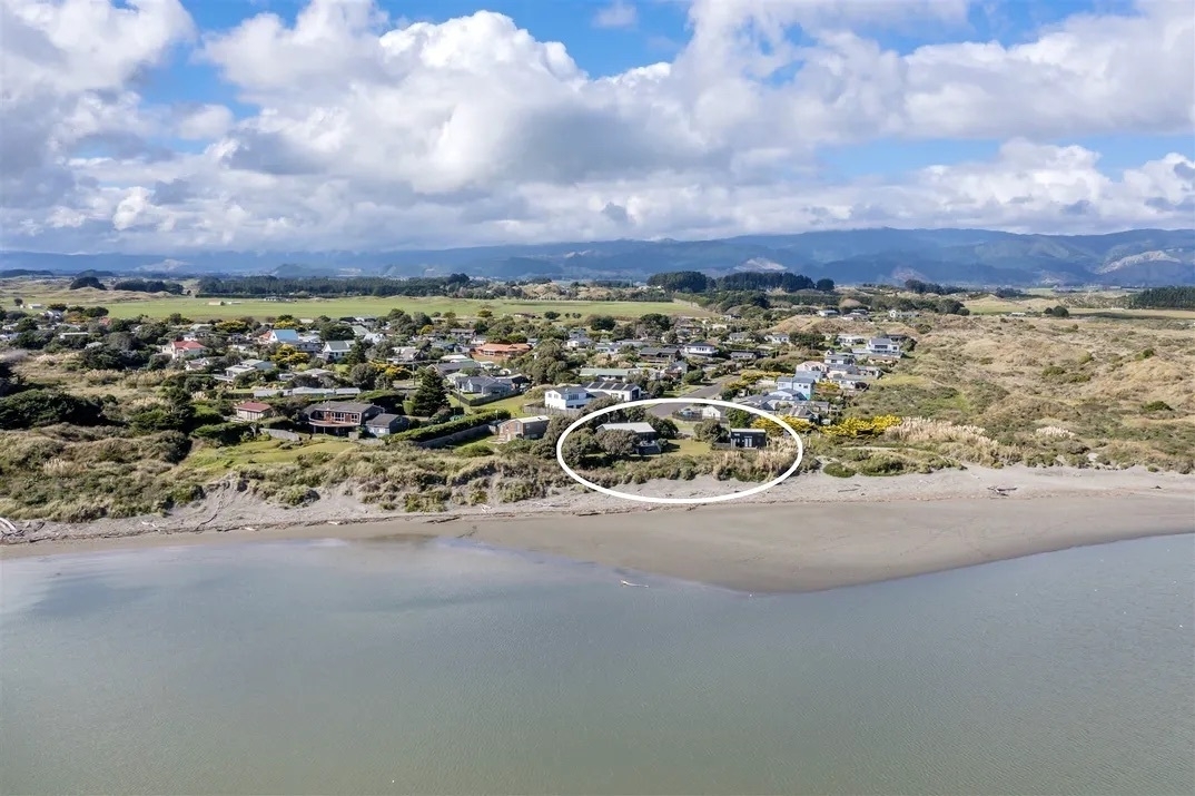 Aerial shot showing beachfront location. 