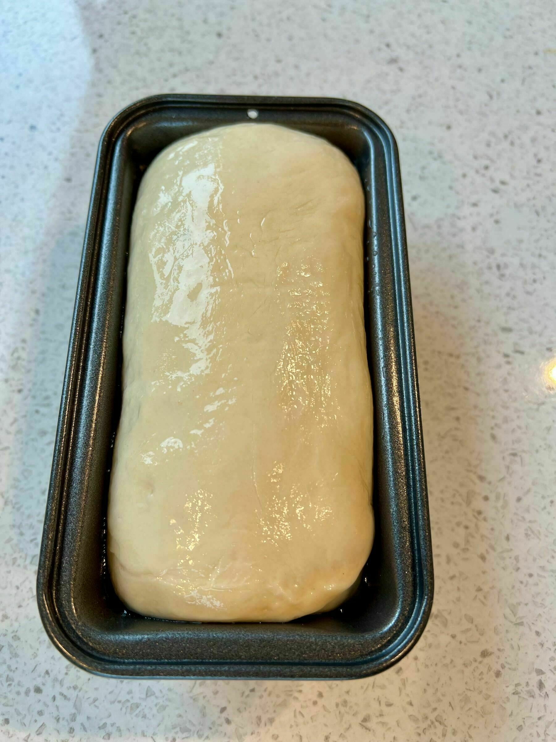 White bread mini loaf, ready to bake. 