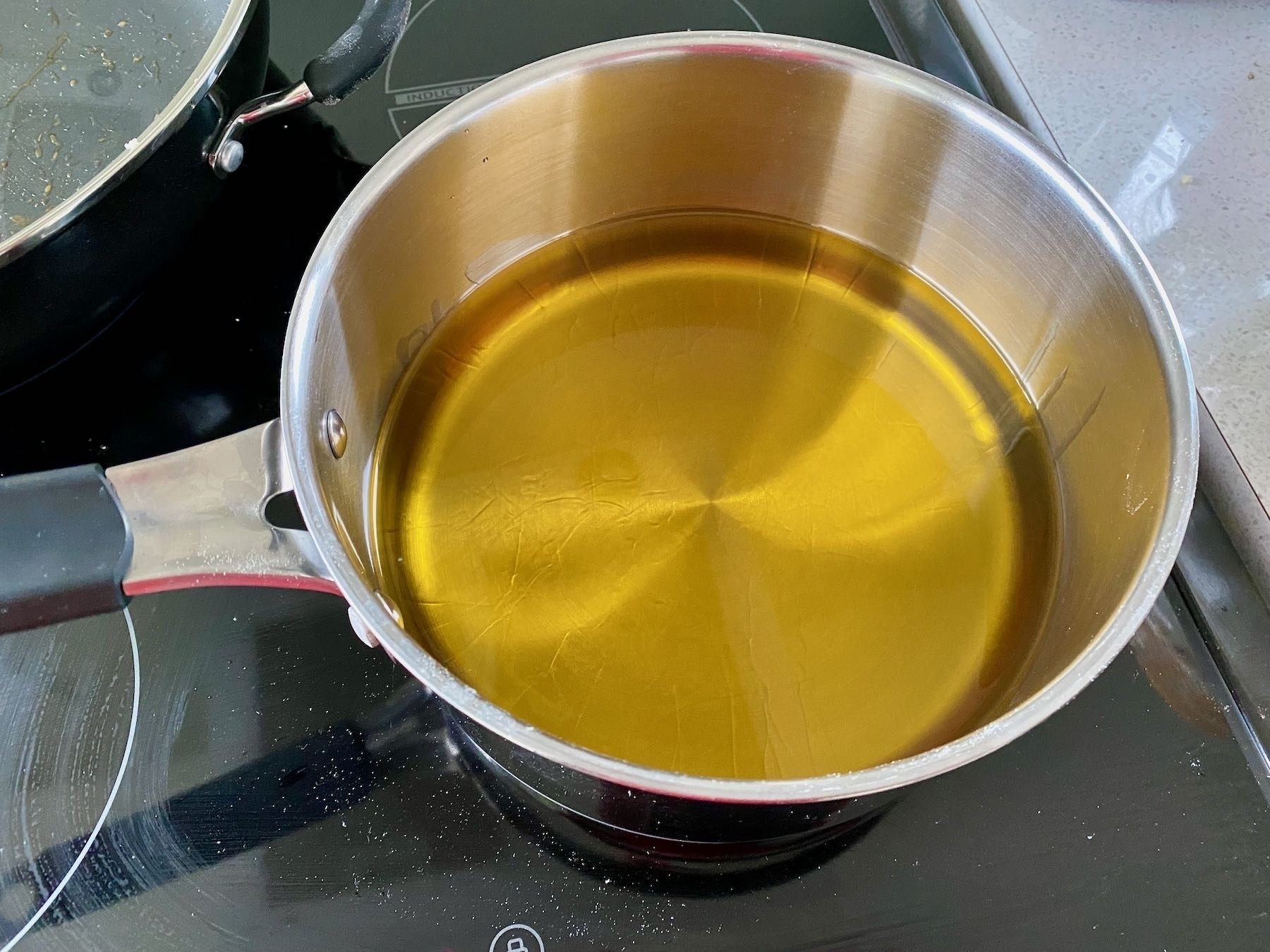 A pan of vegetable oil heating. 