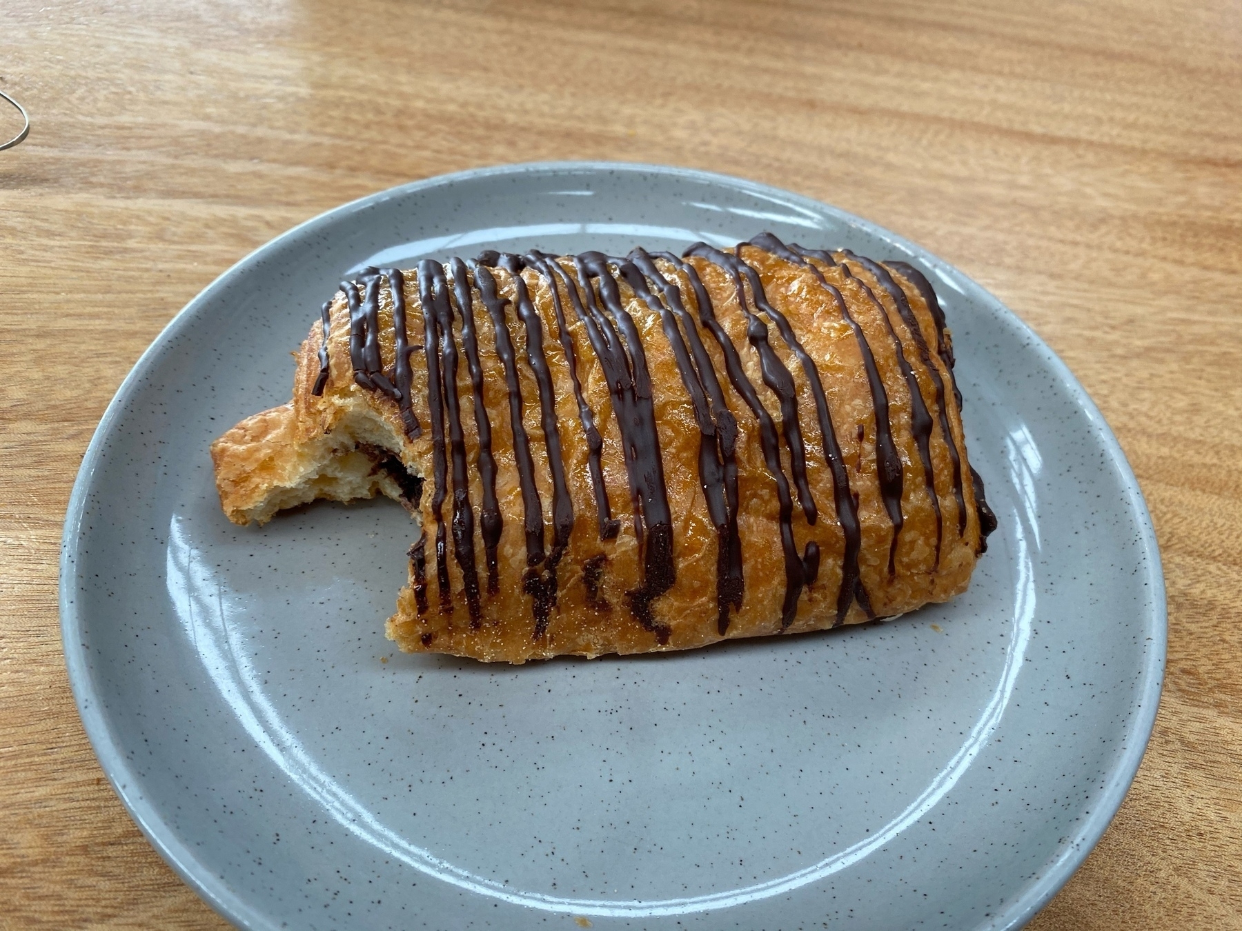 Pan au chocolat with a bite missing. 