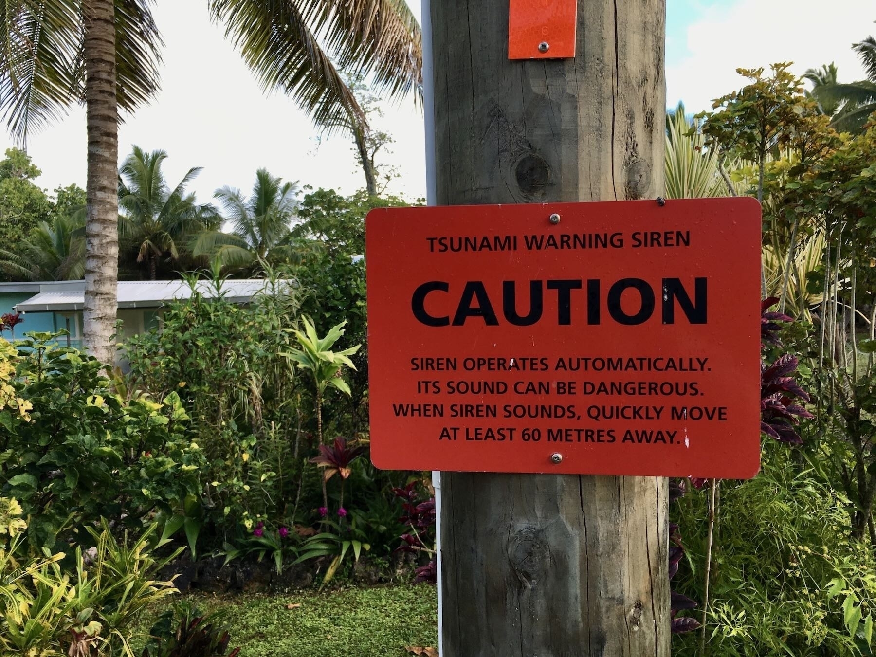 In Niue tsunami siren and warning sign. 