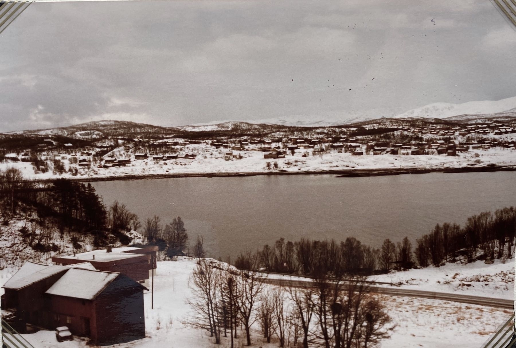 Snowy landscape and a fjord. 