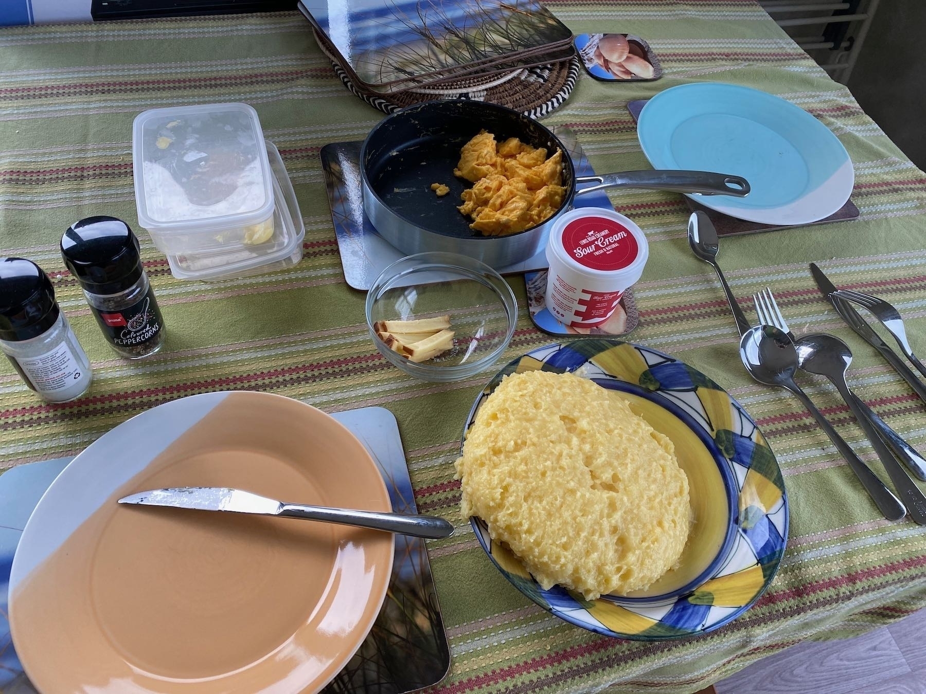 Mamaliga, scrambled eggs, cheese and sour cream. 