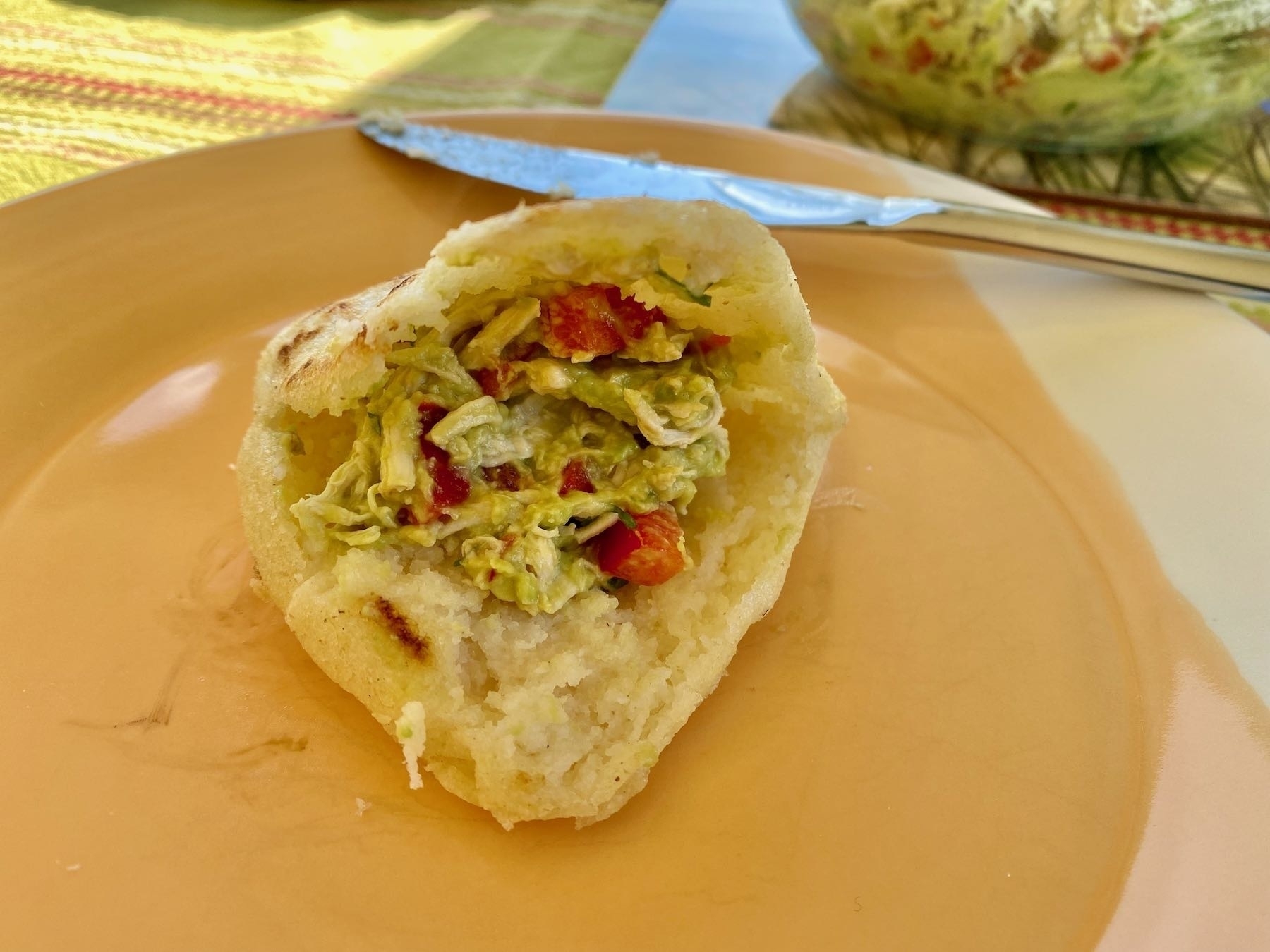 An arepa, cut open and filled. 