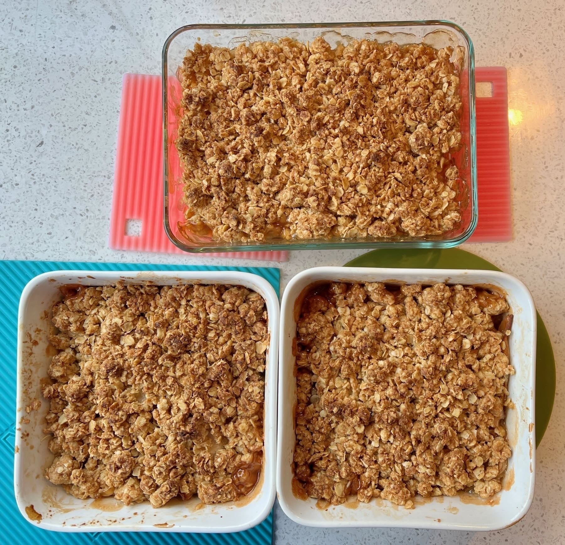 3 dishes of cooked Apple Crisp (taken from directly above). 