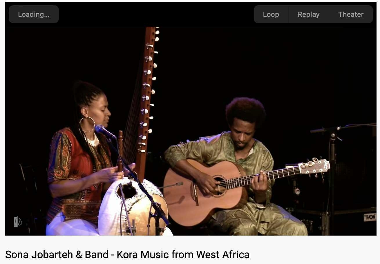 Screenshot showing Sona Jobarteh playing the kora. 