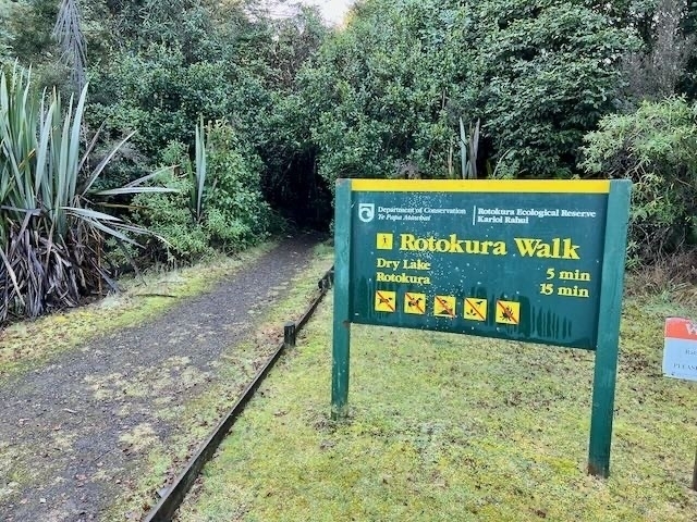 At Lake Rotokura walk sign — 15 minutes one way. 