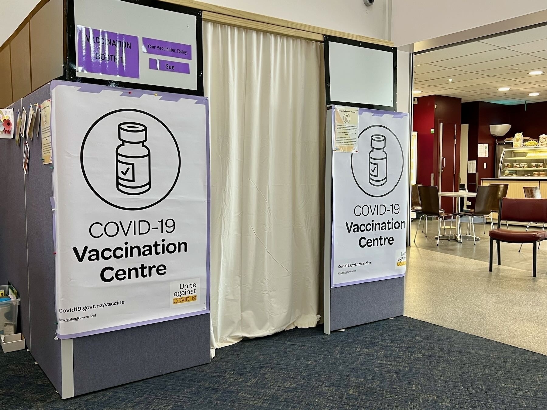 Booster Covid vaccination booth with curtain closed. 