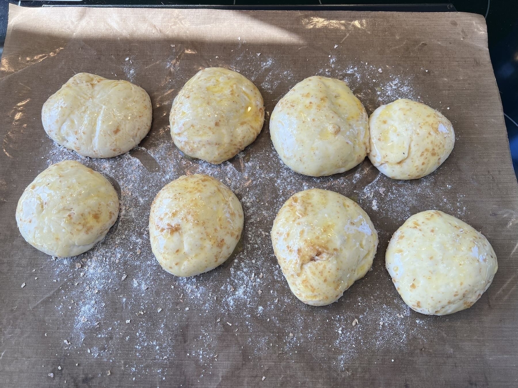 French Bread rolls with butter glaze before baking.