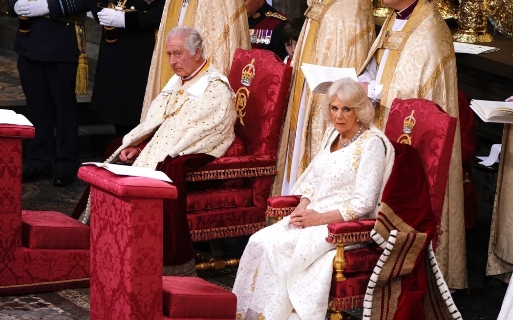 Charles and Camilla on royal chairs. 