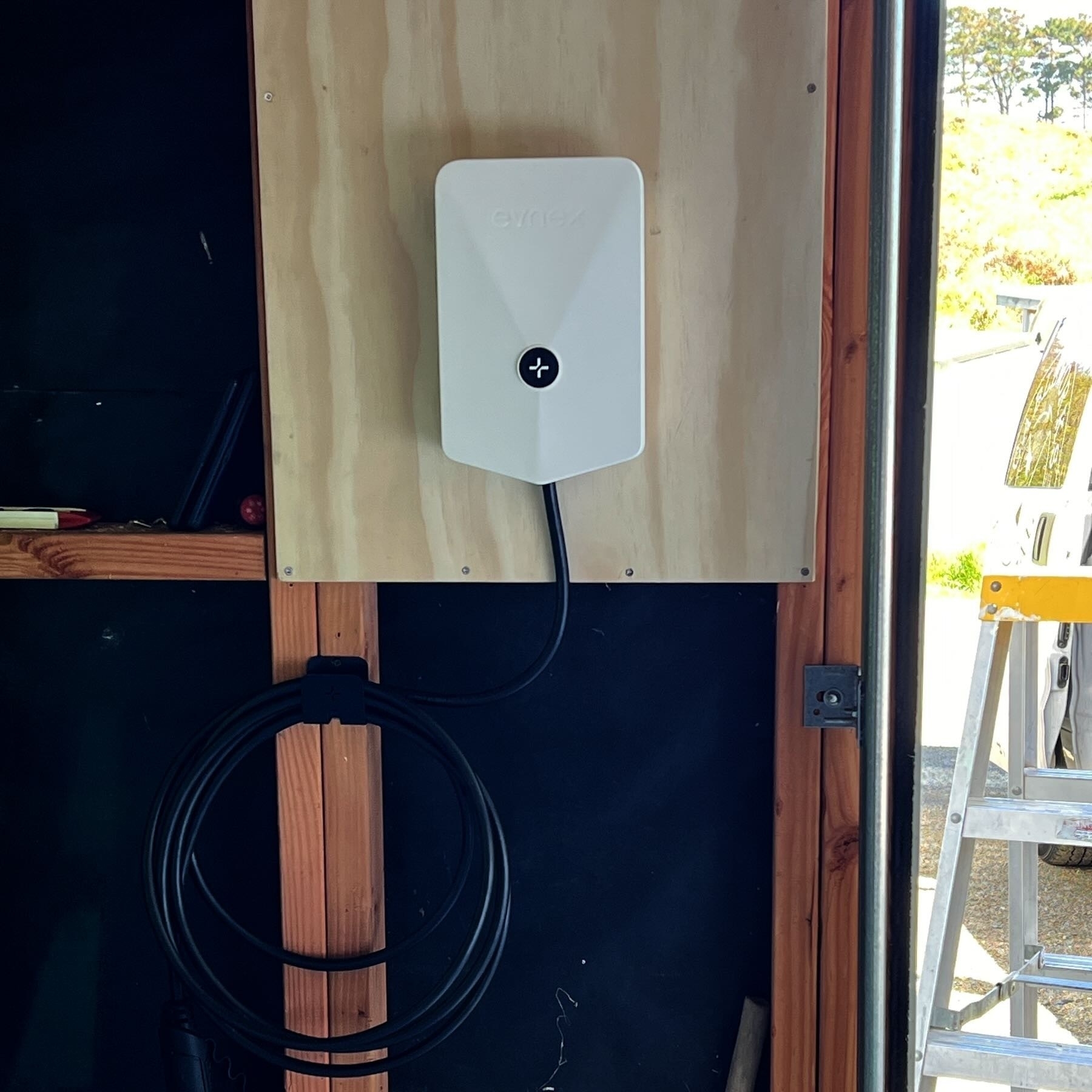 EV charger on a garage wall. 