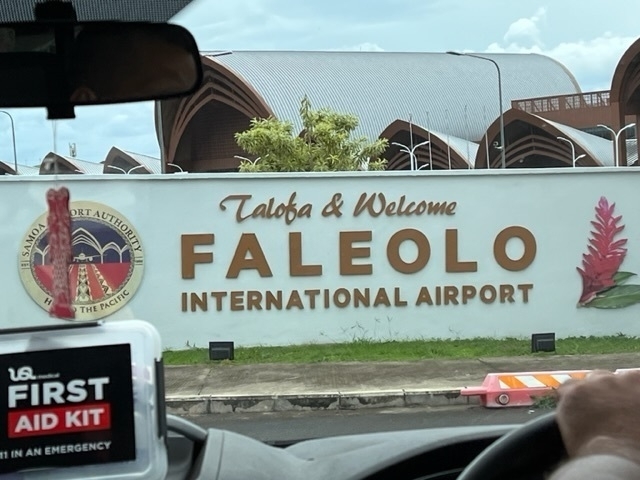 Sign says Faleolo International Airport. 