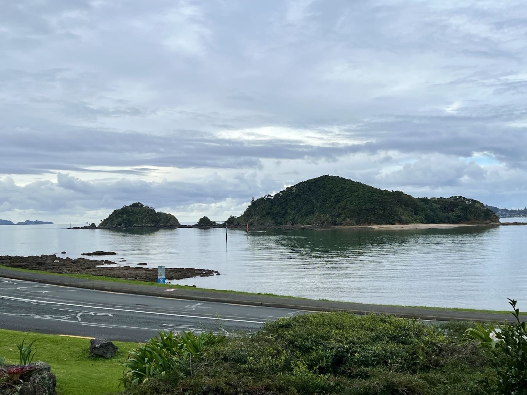 A road, beach, sea, island.