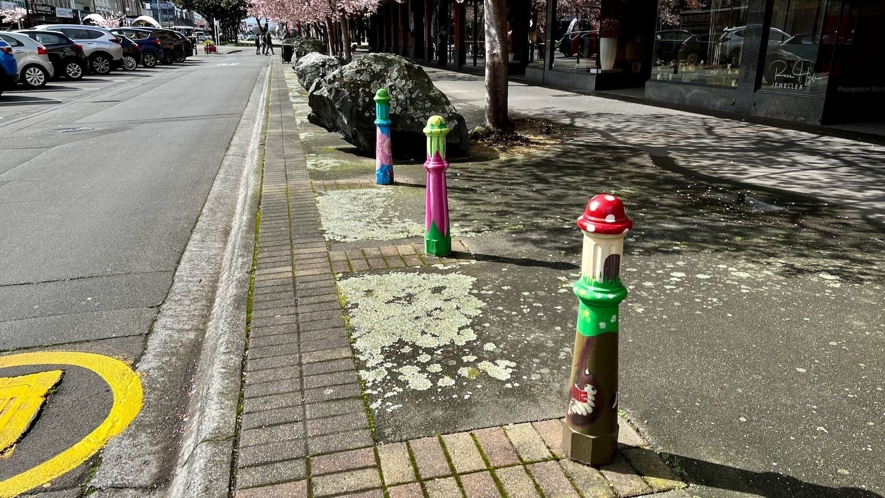 Colourfully painted bollards on Coleman Mall. 