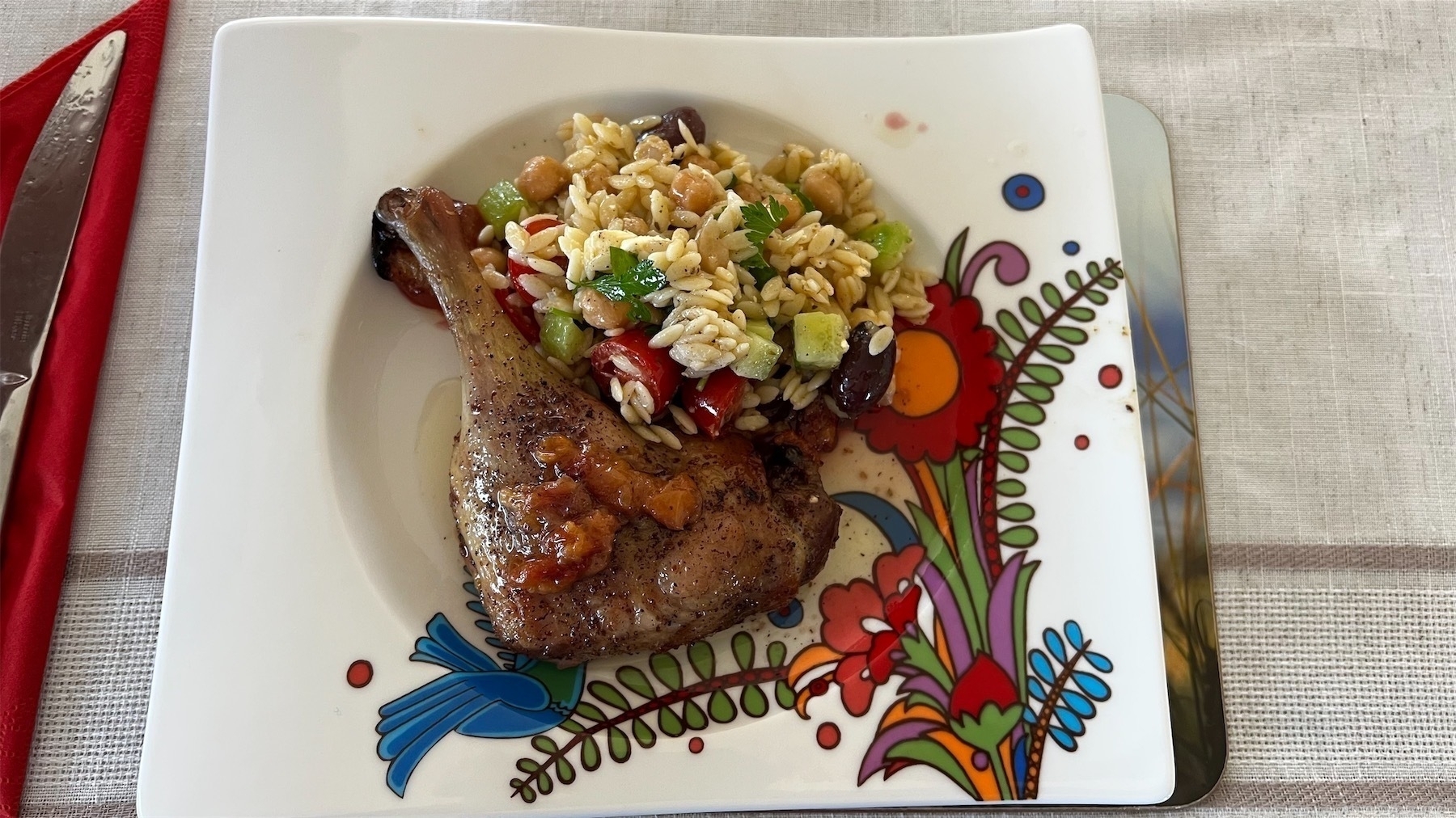 Duck with orzo salad.