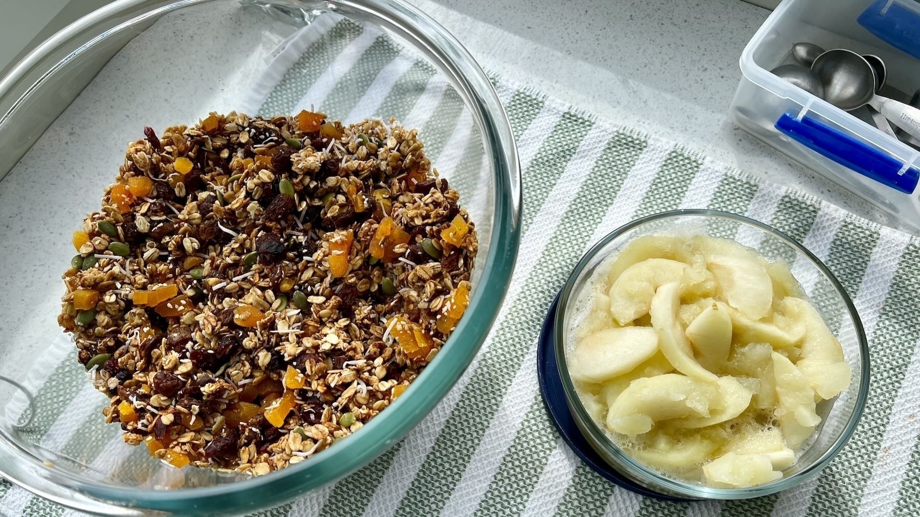 Muesli and stewed apple in bowls.