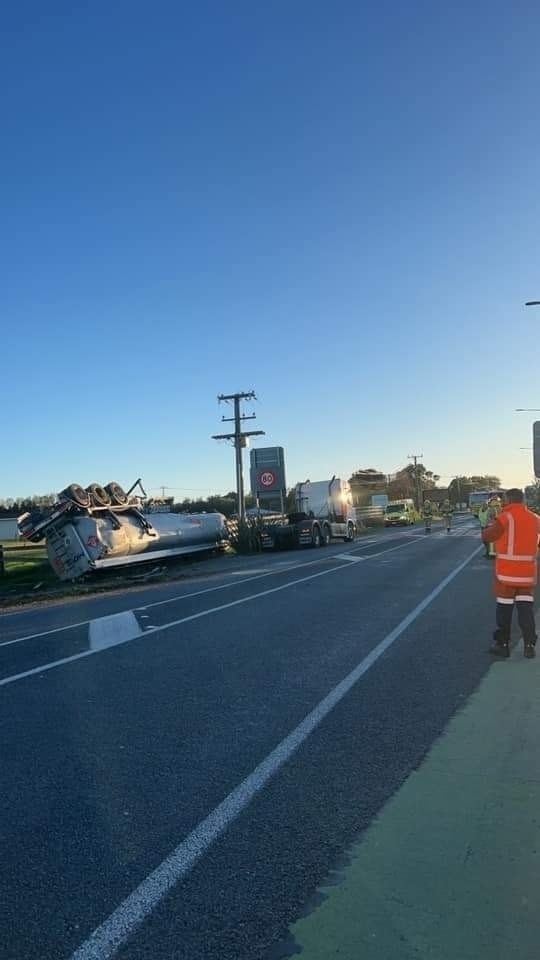 Photo of a tanker truck upside down.
