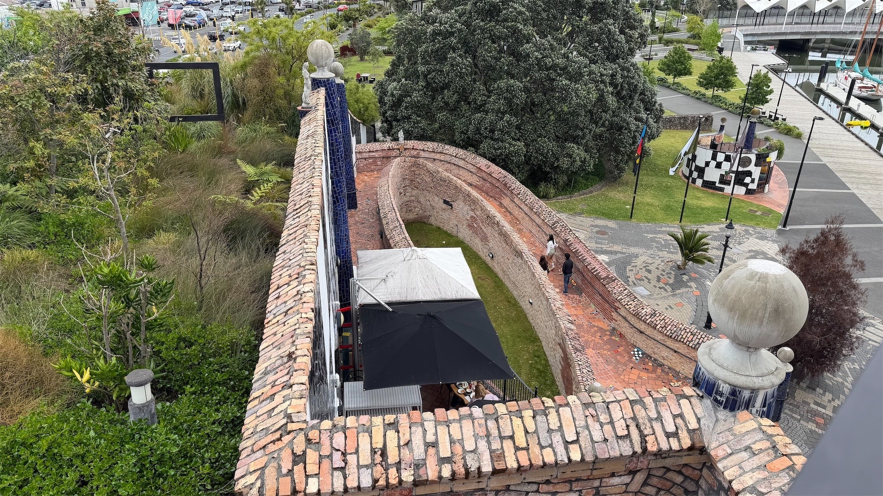 Rooftop forest on the left, slope to cafe entrance on the right.