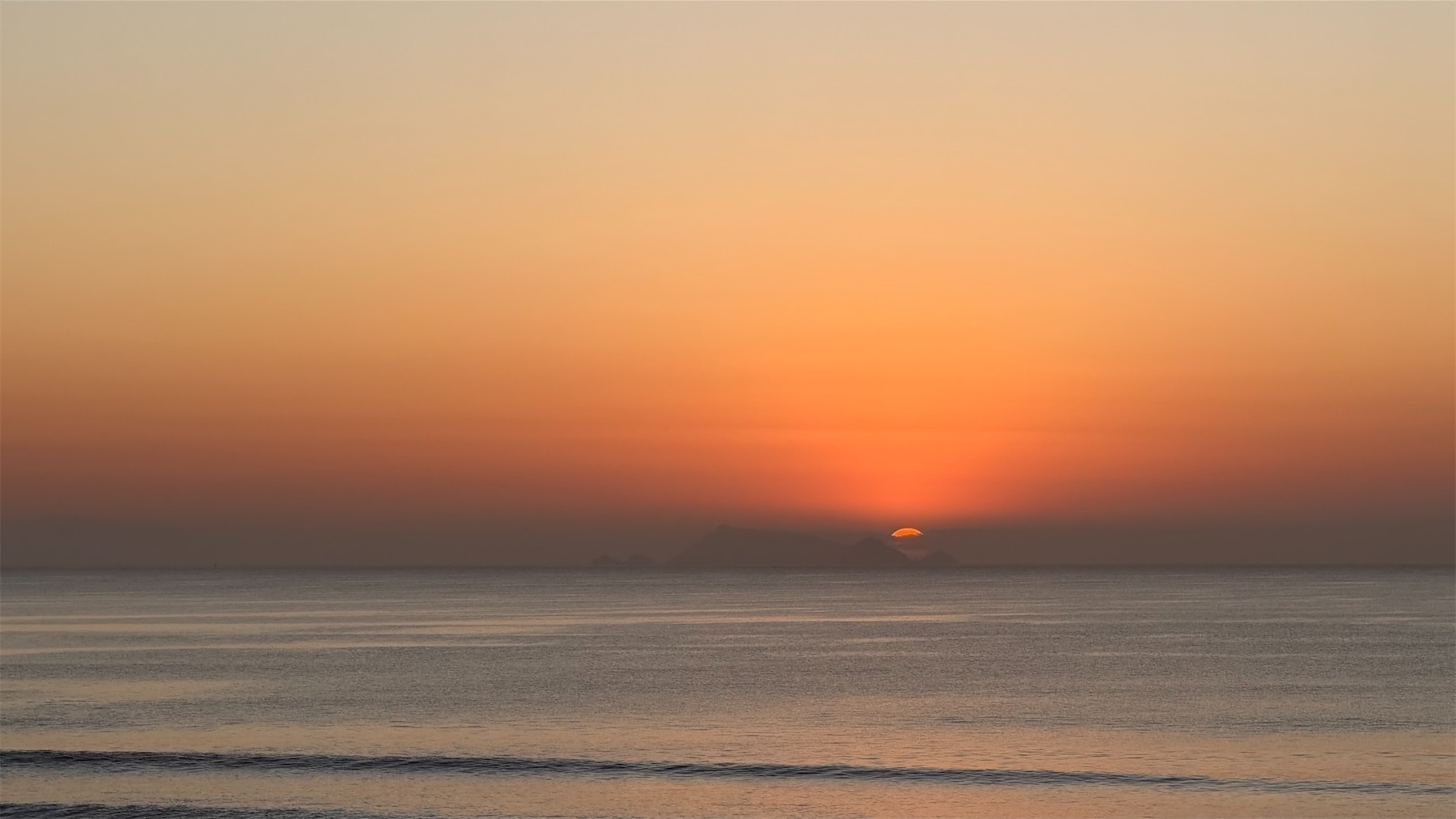 A tiny portion of the sun is showing. 