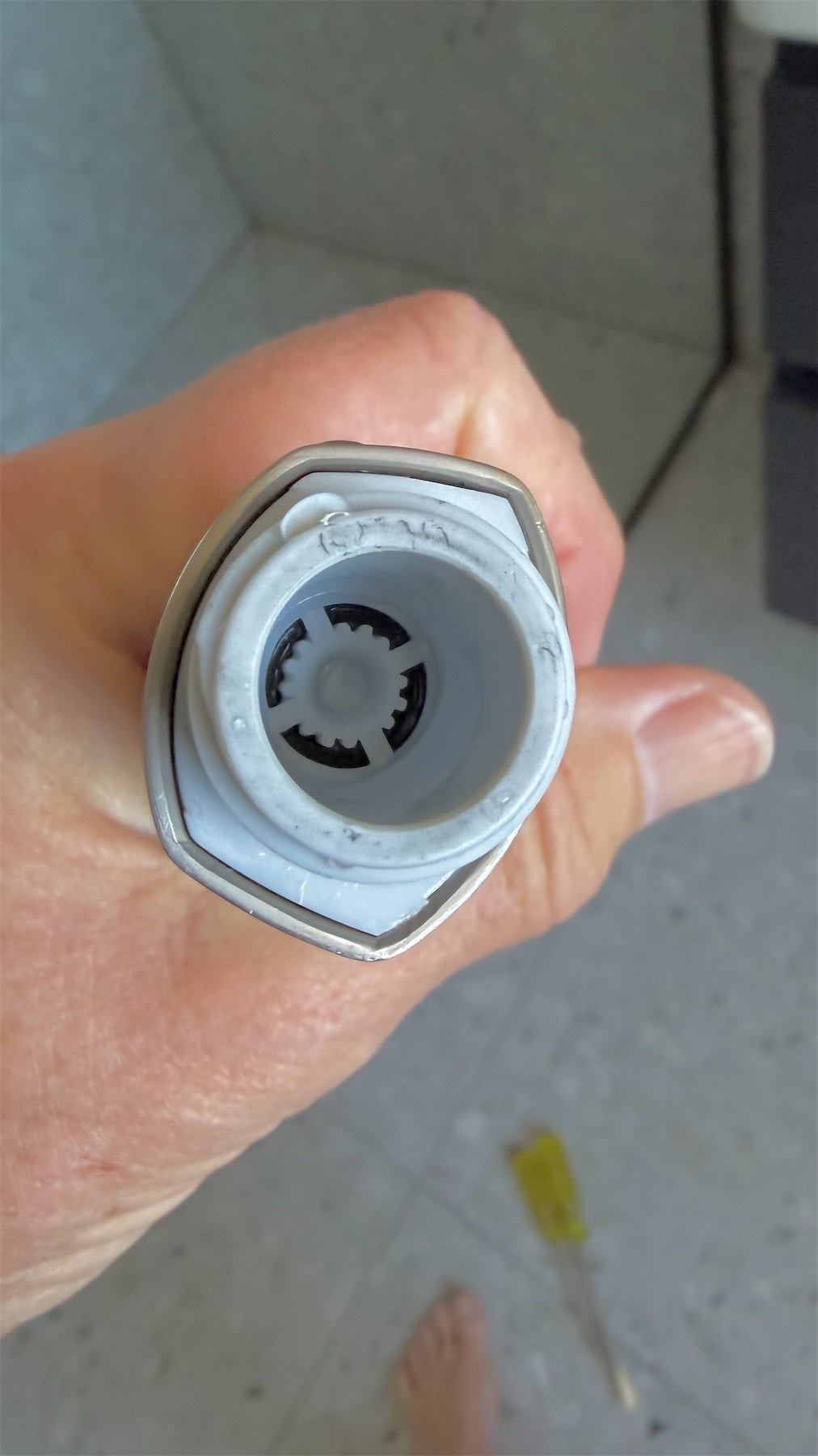 Small plastic disk inside the shower head tube. 