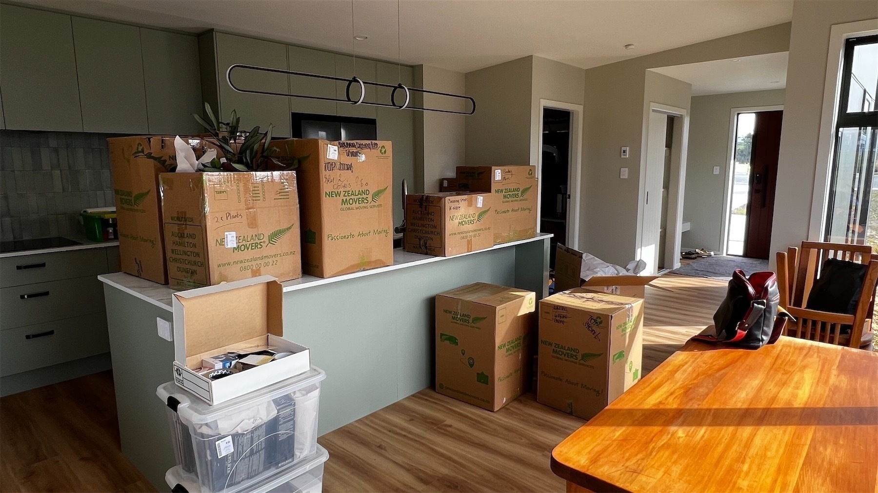 View to the kitchen, covered in yet to be unpacked cardboard boxes.