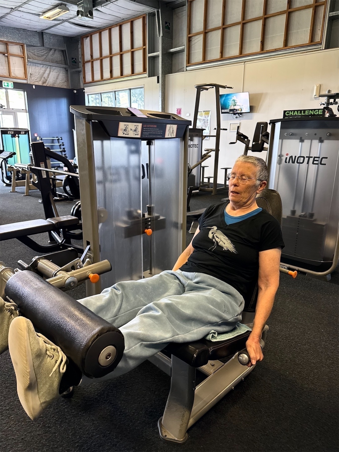 Me doing leg extensions on a machine at the gym.