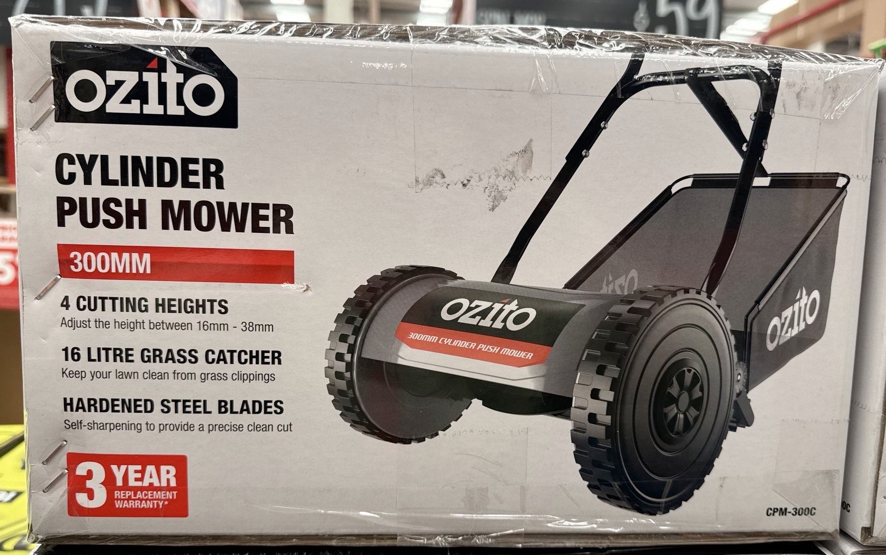 Box marked as a cyclinder push mower. 