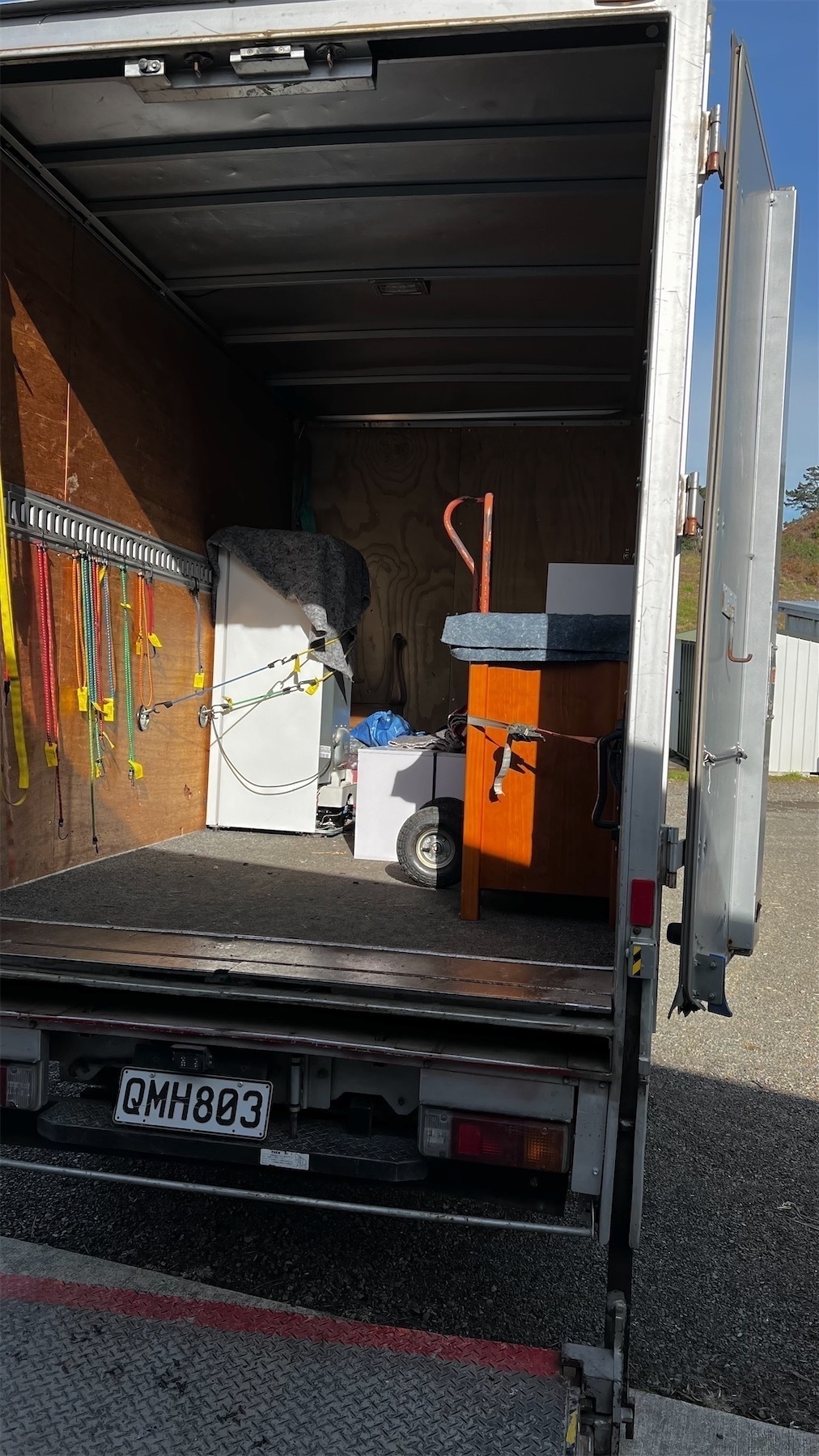 Op-shop truck with some goods loaded.