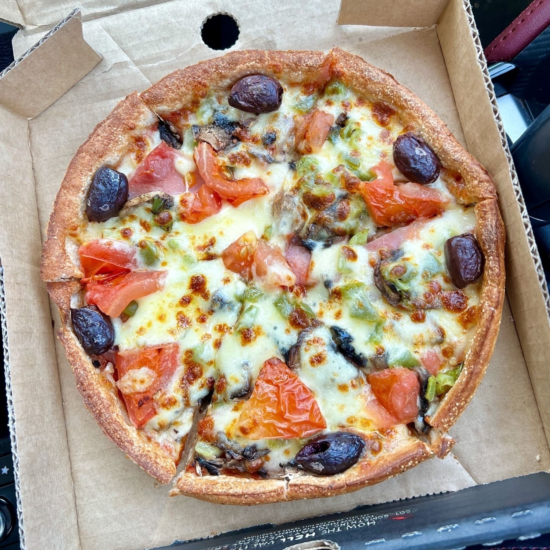 Small pizza in a box.