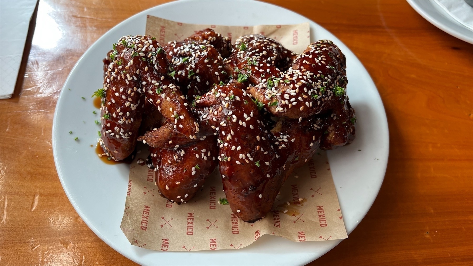A plate of very large chicken wings.