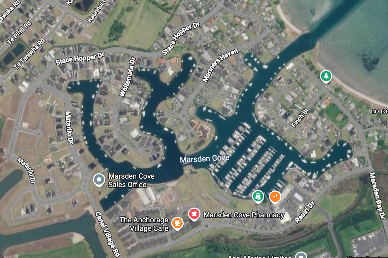 Map shows canals, marina and private jetties.