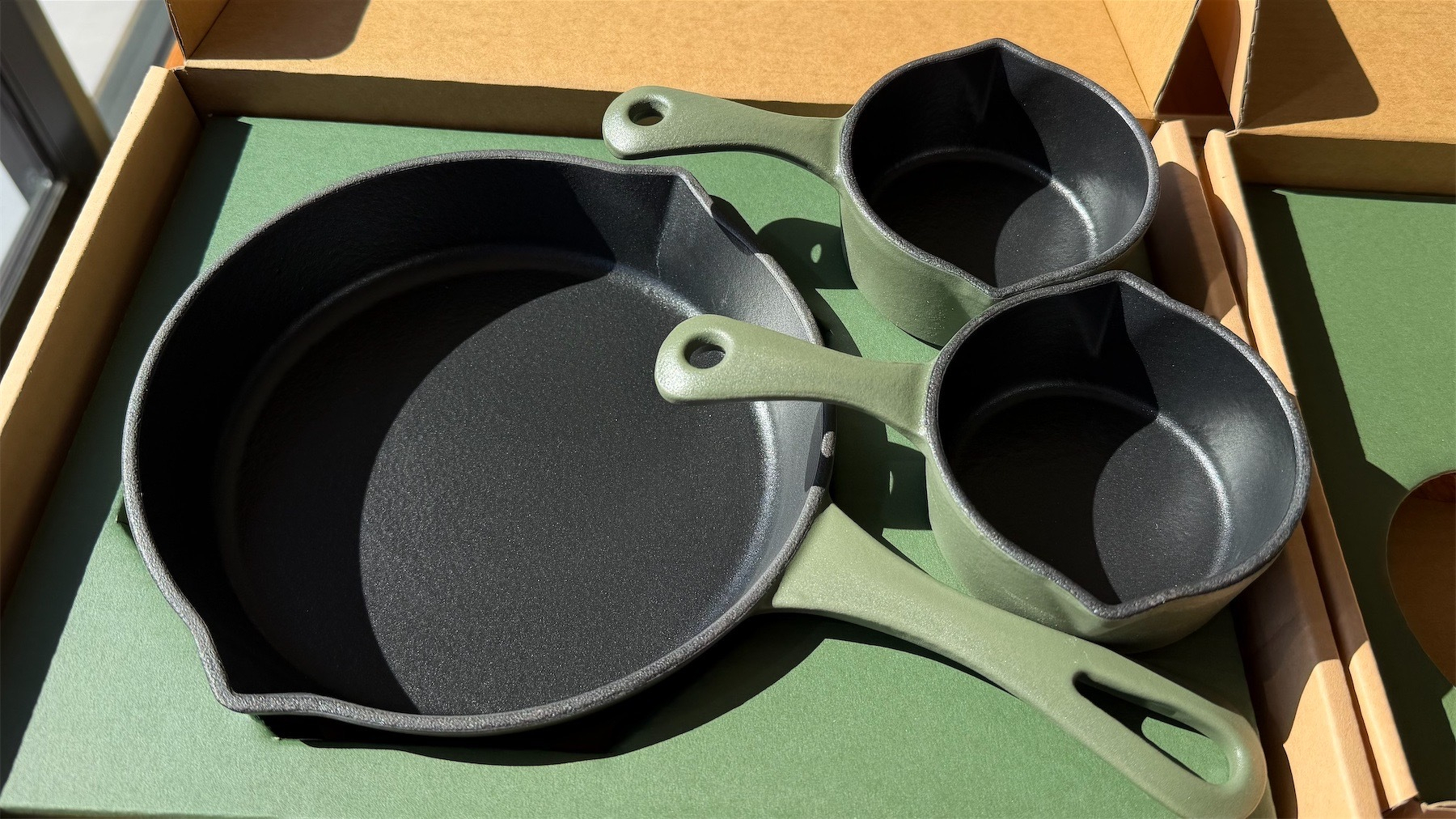 Three cast iron pans.