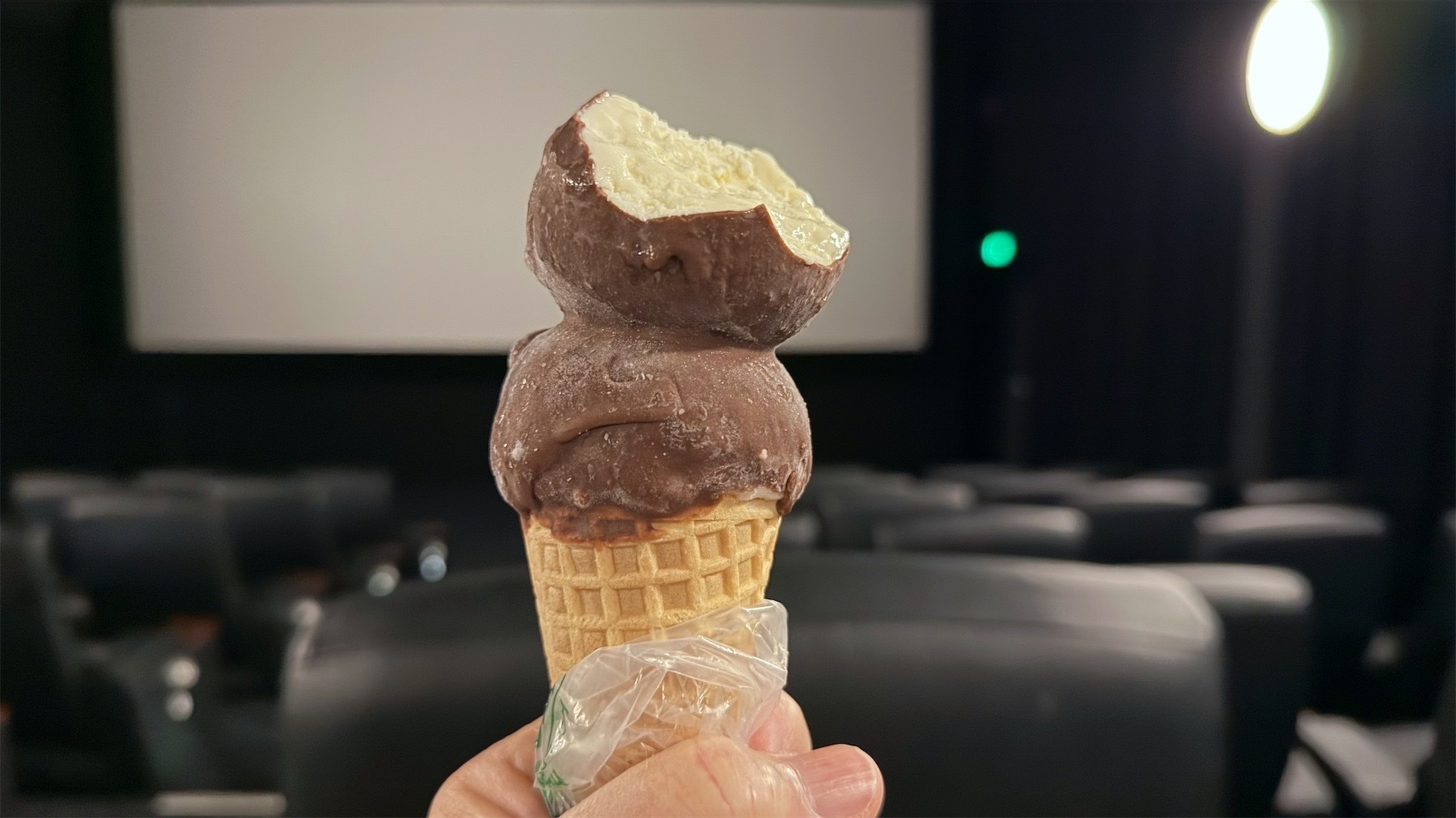 Ice cream held up in an empty movie theatre.