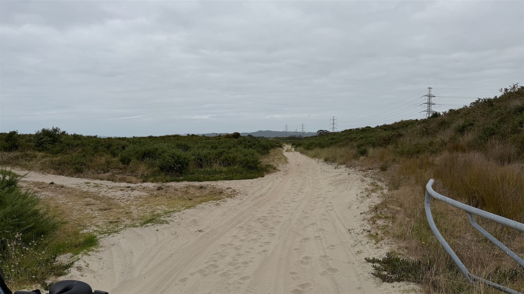 A sandy track with deep ruts from motor vehicles.