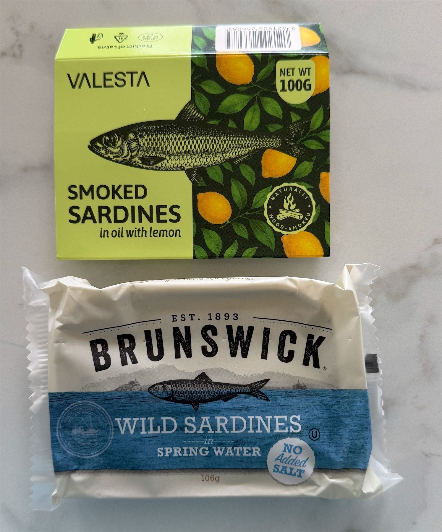 Two sardine tins together, one Valesta, one Brunswick. 