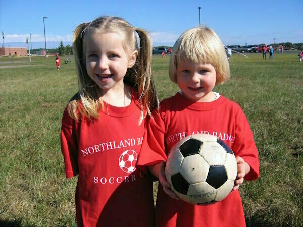 Kaylee and Grace in soccer shirts
