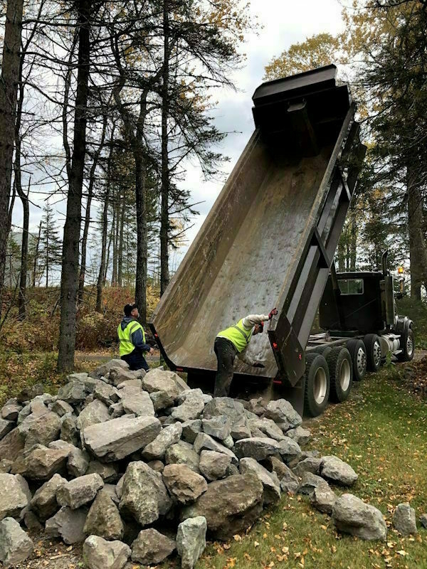 Dump truck and boulders