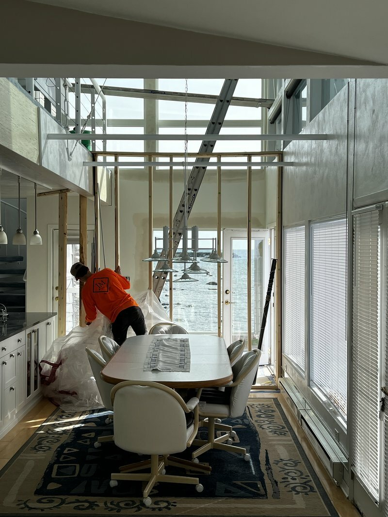 Construction worker installing windows