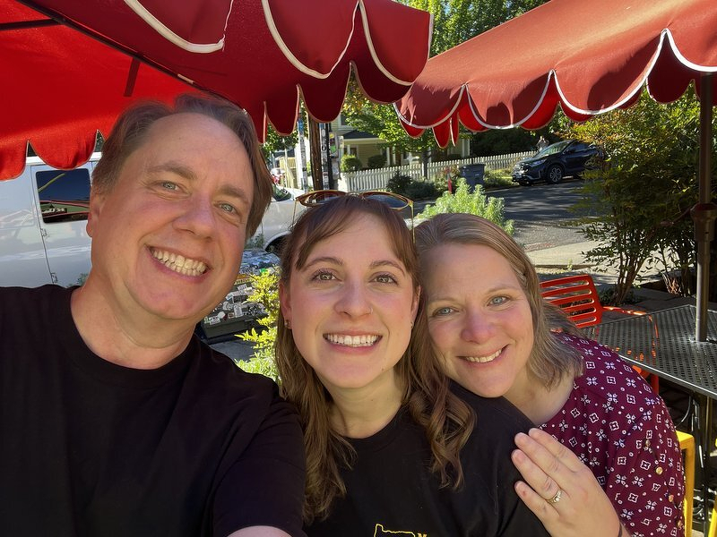 Justin, Kelsie, and Jody on a restaurant patio in Ashland