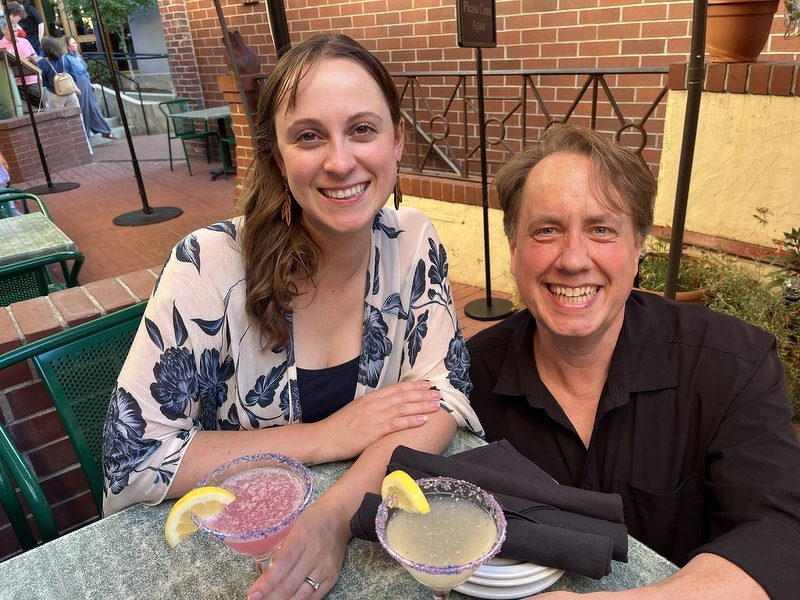 Justin and Kelsie having margaritas on a patio in Ashland